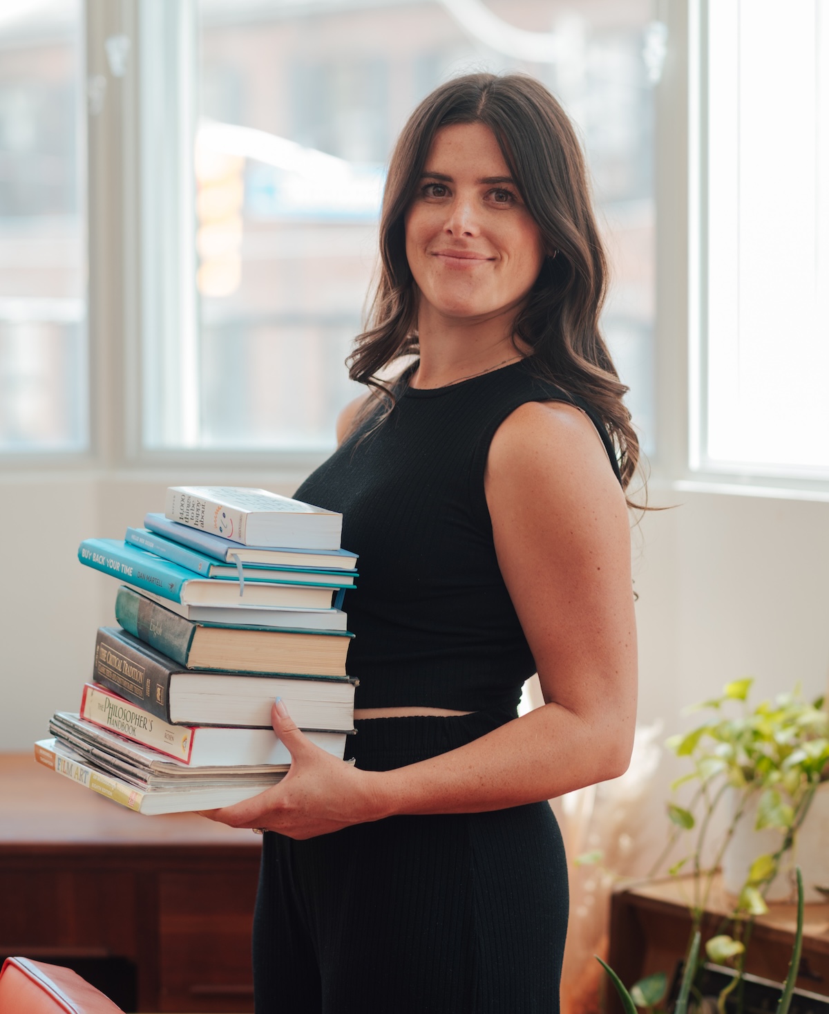 Taylor Scully holding website design books